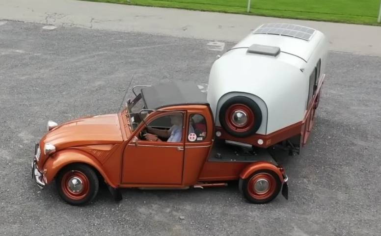 The old Citroen 2CV has become a truck tractor and now tows a motorhome