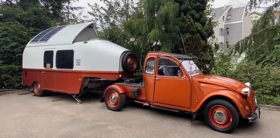 The old Citroen 2CV has become a truck tractor and now tows a motorhome